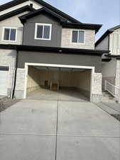 Garage with concrete driveway