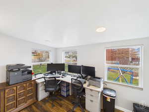 Office featuring dark wood-style flooring and baseboards