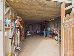 View of storage area backyard under Deck