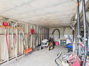 View of storage area backyard under Deck