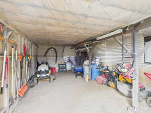 View of storage area backyard under Deck
