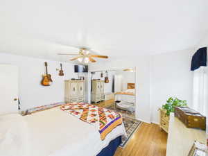 Bedroom featuring light wood-type flooring and ceiling fan