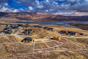 View of property location with a water and mountain view and property boundaries highlighted