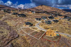 Aerial perspective of suburban area featuring a mountain backdrop