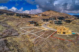 View of mountain backdrop featuring nearby suburban area