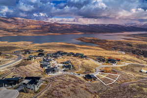 Aerial view of residential area featuring a water and mountain view