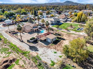 Aerial perspective of suburban area with a mountainous background