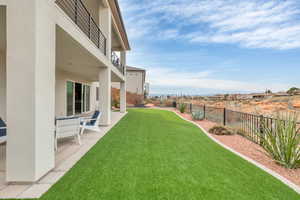 Fenced backyard featuring a patio