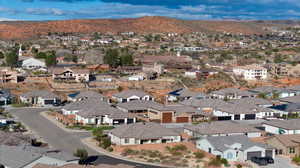Aerial perspective of suburban area featuring a mountainous background