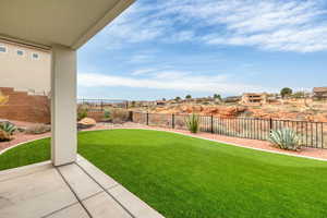 Fenced backyard featuring a patio