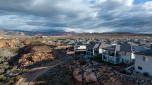 Aerial perspective of suburban area featuring a mountainous background