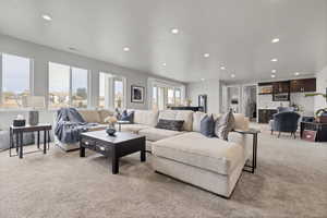 Living room featuring light carpet and recessed lighting