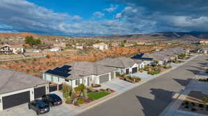 Aerial perspective of suburban area with a mountainous background