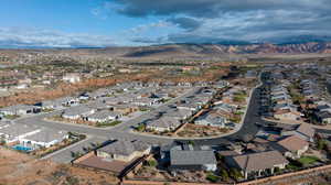 Aerial perspective of suburban area featuring a mountainous background