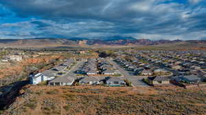 Aerial perspective of suburban area featuring a mountainous background