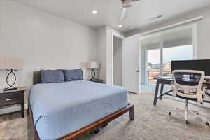 Bedroom featuring a desk, light colored carpet, access to exterior, a ceiling fan, and recessed lighting