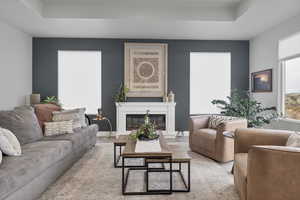 Living area featuring a glass covered fireplace