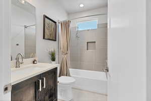 Bathroom featuring vanity and shower / bath combo