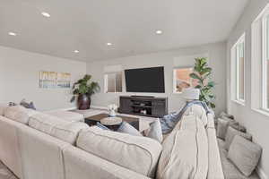Living area featuring carpet and recessed lighting