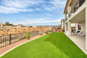 Fenced backyard with a patio area