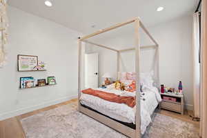 Bedroom featuring light wood-style flooring and recessed lighting