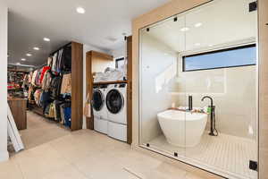 Laundry area with separate washer and dryer, recessed lighting, and light tile patterned flooring