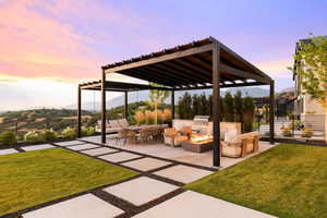 View of patio featuring an outdoor fire pit, an outdoor kitchen and area to lounge, a pergola, and a mountain view