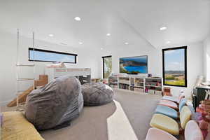 Carpeted living room with recessed lighting