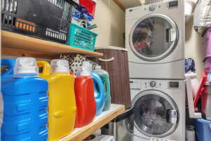 Laundry room featuring stacked washer / dryer