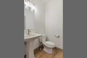 Bathroom with baseboards and light wood-style floors