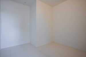 Unfurnished room featuring tile patterned floors