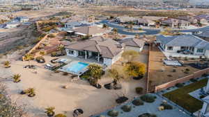 Aerial perspective of suburban area featuring a pool
