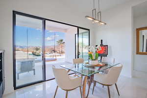 Dining area featuring light tile patterned floors