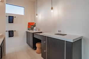 Bathroom featuring vanity and light tile patterned floors