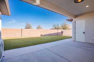Fenced backyard featuring a patio area