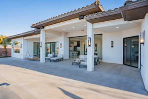 View of patio with an outdoor hangout area