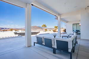 View of patio featuring a mountain view and outdoor lounge area