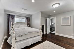 Bedroom with dark wood-type flooring and recessed lighting