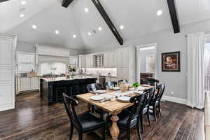 Dining space with vaulted ceiling, dark wood-style floors, and recessed lighting
