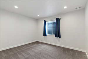 Spare room with carpet and recessed lighting