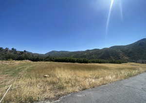 View of mountain background featuring rural landscape