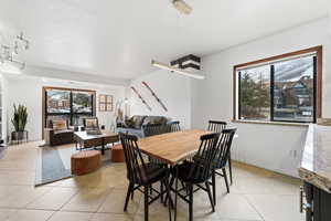 Dining room featuring a textured ceiling and light tile patterned floors