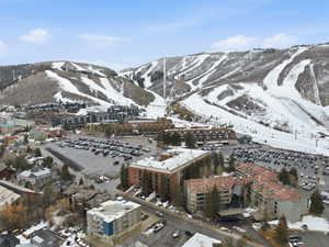 Snowy aerial view featuring a mountain view