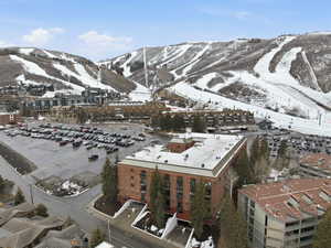 Snowy aerial view featuring a mountain view