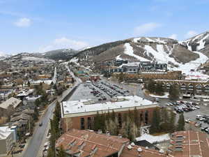 Snowy aerial view featuring a mountain view
