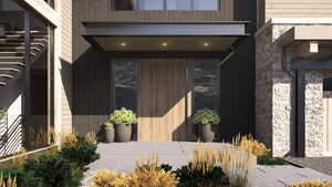 Property entrance featuring a patio area