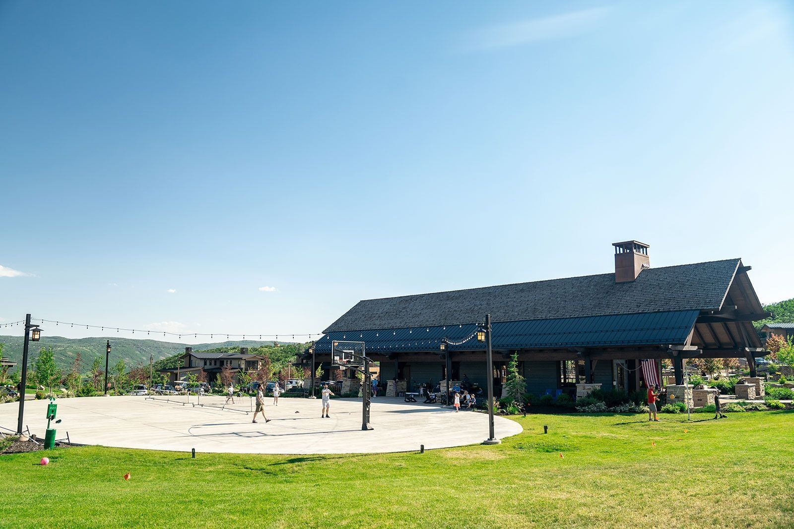 View of home's community featuring a patio area and community basketball court