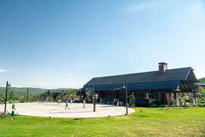 View of home's community featuring a patio area and community basketball court