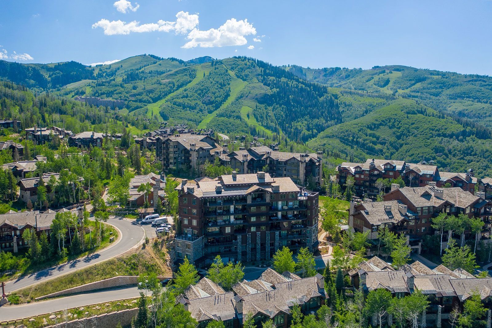 Aerial view of residential area featuring a mountain backdrop