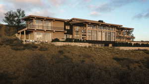 Back of property featuring a balcony